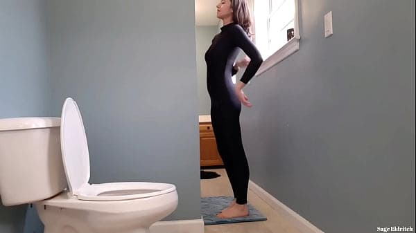 Pee Desperation: Sage Eldritch Peeing in Black Catsuit